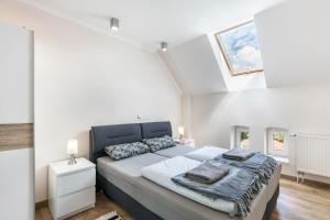 a bedroom with a large bed in a attic at Ferienwohnung mit großem Garten in Lindow