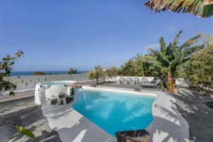 a swimming pool in the middle of a resort at Finca Oasis Samuel in Garachico