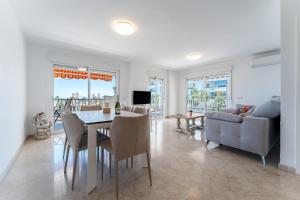 a living room with a dining table and a couch at Paraiso in Fuengirola