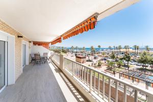a balcony with a view of the beach at Paraiso in Fuengirola