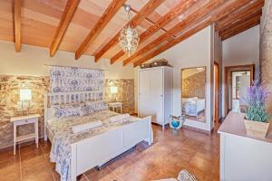 a bedroom with a large bed in a room at Casa Martin in Calvià