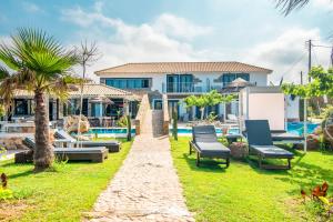 a villa with a swimming pool and a resort at Mirage Arillas Studio Type C19 in Arillas