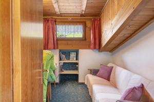a small room with a couch and a window at Ferienhaus Leitner in Tires