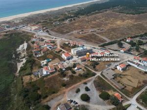 an aerial view of a town next to the beach at Encanto da Praia in Santo André