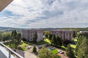 a view of two apartment buildings from a balcony at Ferienwohnung Harzblick in Altenau