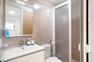 a bathroom with a toilet and a sink and a shower at Apartamento La Morena 3a in El Pris