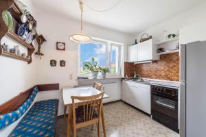 a kitchen with a table and a dining room at Haus Schild in Grassau