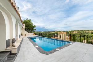 a swimming pool in the backyard of a house at Las Ramblas in Orihuela