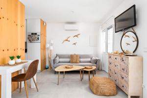 a living room with a couch and a table at Marce in Ciutadella