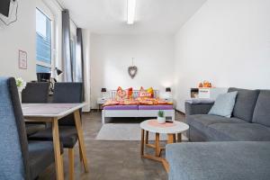 a living room with a couch and a table at Peenecamp Neukalen, Campingplatz in Neukalen