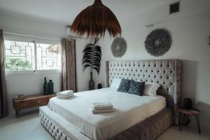 a bedroom with a large bed with a large headboard at Villa Carol in Illes Balears +37 photos