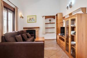 a living room with a couch and a fireplace at Villa Perez Zara 3 in Campano
