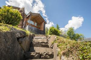 a set of stairs leading up to a house at Haus der Sinne Bregenzerwald in Tannen