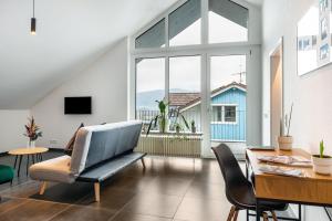 a living room with a couch and a table at Sonne und Mehr in Stockach