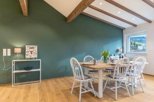 a dining room with a table and chairs at Ferienwohnung Kist in Sasbachwalden