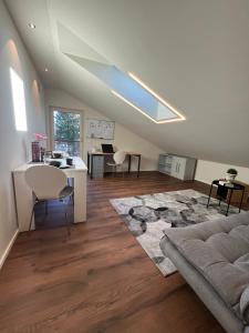 a living room with a couch and a table at Ferienwohnung Rudi in Taching am See