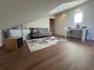 a living room with a couch and a table at Ferienwohnung Rudi in Taching am See +25 photos