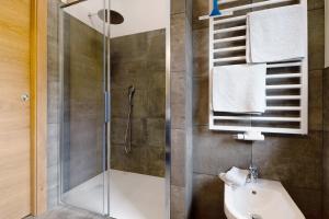 a bathroom with a shower and a sink at Furnerhof Apt Olpenglühn in Collepietra +25 photos