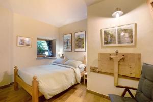 a bedroom with a large bed and a window at Chalet 1175 - Grand-haury in Arvier