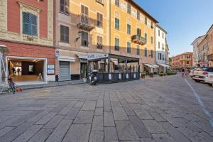 an empty street in a city with buildings at Cinema Boutique Apartment Sestri in Sestri Levante