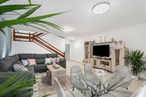 a living room with a couch and a table at Villa en Las Caletillas in Punta Larga