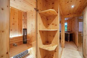 a wooden cabin with wooden walls and wooden shelves at Wein- und Klimahotel Bergfriedel in Bühlertal +286 photos