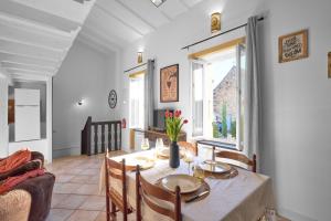 a dining room with a table and chairs at Maison Séjour Capraisien in Saint-Capraise-de-Lalinde +36 photos