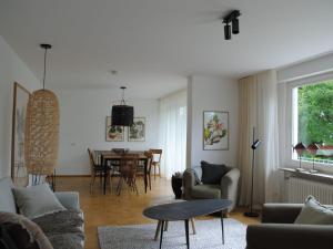 a living room with a couch and a table at Ferienhaus Joos in Uhldingen-Mühlhofen