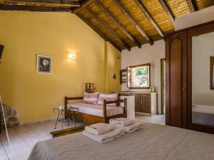 a bedroom with a bed with towels on it at Adamantia Studio S2 in Gaios +2 photos