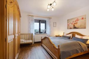 a bedroom with a large bed and a window at Buchhaus Vier - Mittelgeschoss in Kirchenlamitz