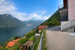 a view of a body of water with mountains at Appartamento 3 Il Tornante in Nesso