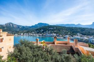 a house with a view of a body of water at Montemar 33 in Port de Soller