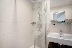 a bathroom with a shower and a sink at The View in Bad Reichenhall