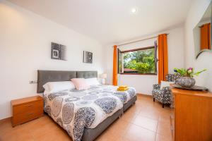 a bedroom with a bed and a window at Luxurious villa Sol de Mallorca in Sol de Mallorca +31 photos