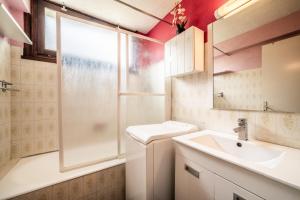 a bathroom with a sink and a shower at Appartement en residence in Morzine +14 photos