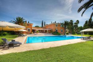 a swimming pool in front of a house at Le dimore di Elia in Lecce