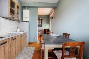 a kitchen with a table and chairs in a room at 5 Terre - Lerici - Aless View in Lerici +30 photos