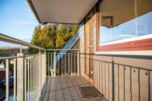 a balcony of a house with a window at Haus Heidorn in Sittensen