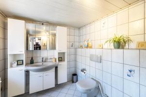 a bathroom with a toilet and a sink at Lichtblick in Bottrop +18 photos