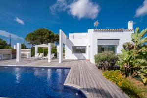 a villa with a swimming pool and a house at Villa Xipell 9 in Cala Santandria