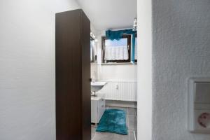 a bathroom with a sink and a mirror at Fewo Nele in Gries +14 photos