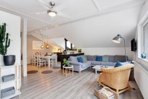 a living room with a couch and a table at Ferienwohnung Pöttner in Germete +18 photos