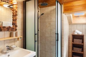 a bathroom with a sink and a shower at Ferienwohnungen St Christoph in Mittenwald +52 photos