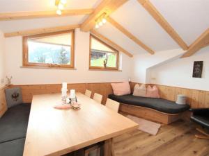 a living room with a table and a couch at Apartment Melissa in Zellberg