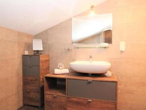a bathroom with a sink and a mirror at Apartment Melissa in Zellberg +32 photos