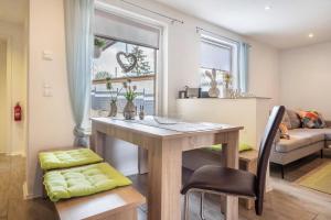 a kitchen and living room with a table and a couch at Ferienhaus Hedrich in Gülzow