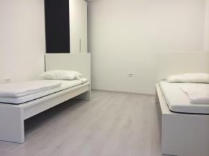 Postelja oz. postelje v sobi nastanitve Apartments Šik 2