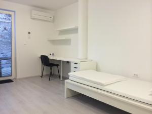 Postelja oz. postelje v sobi nastanitve Apartments Šik 2