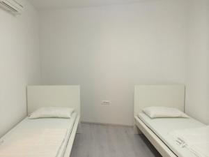 Postelja oz. postelje v sobi nastanitve Apartments Šik 2