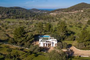 an aerial view of a white house with a swimming pool at Can Ramon 1 in Sant Josep de sa Talaia